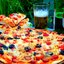 Пицца с егерскими колбасками и помидорами черри
